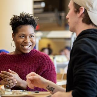 TCU students laugh together at lunch in the student union